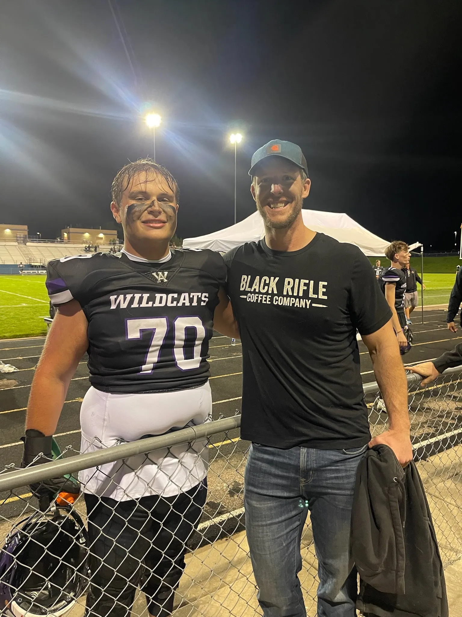 physical therapist from Alpine Physical Therapy and Sports Performance with a football player from a local team